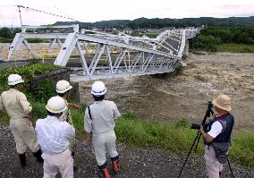 Bridge in Nagano buckles under floodwaters